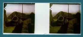 [Two people in car on mountain road]