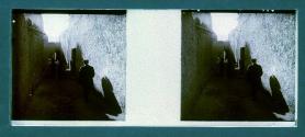 [People in alleyway between buildings]
