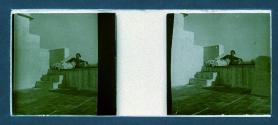 [Man reclining on steps]