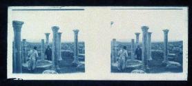 [Two men viewing ruins]
