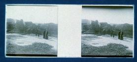 [People in front of ruins]