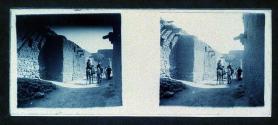 [People riding horses on road]