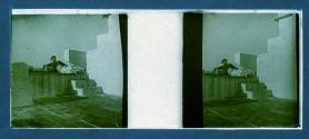 [Man reclining on steps]