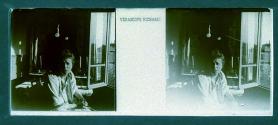 [Unid. woman at window]