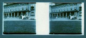 [Man in front of hotel]