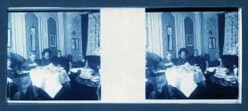 [Unid. group around table]