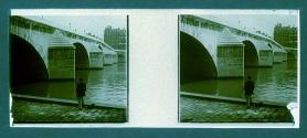[Man by bridge and water]