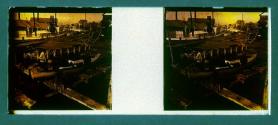 [Two men in boat at shipyards]