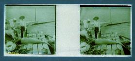 [Three people and shark on dock]