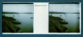 [View of cliffs water and boats]