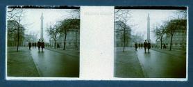 [People in front of statue and buildings - possibly London]
