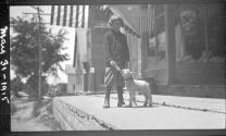Girl feeding lamb with bottle, Automobile Trip