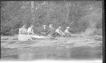George Eastman and friends picnicing near river