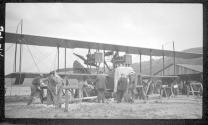 Men with early type airplane, Aviation Meet