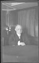George Eastman at table with irritated skin, Labrador Trip