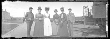 George Eastman and companions beside train, California Trip