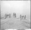 People standing near cannons on hilltop-Battle site