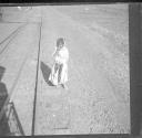 Child next to railroad tracks