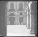 Arched doorways with guards in front
