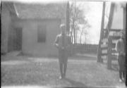 Boy standing on lawn