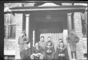 Group portrait in front of house