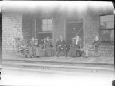 George Eastman on porch with guests, Oak Lodge Trip