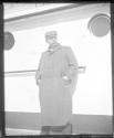 Man standing on deck of ship