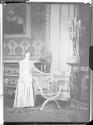Young unidentified woman in unidentified house