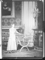 Young unidentified woman in unidentified house