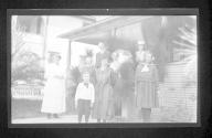 [Group of people outside house]