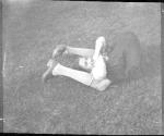 [Girl with legs over head]