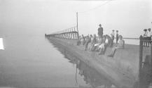 [Children on pier at lake]