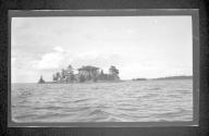 [House on island in river]