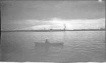 [Man rowing on river]
