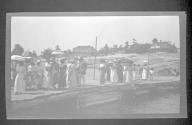 [Group of people on dock]