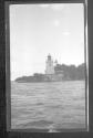 [Lighthouse along river]