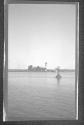 [Lighthouse on small island in river]