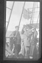 [Man with sextant on pas senger ship]