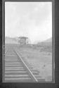[Small tower along railr oad tracks]