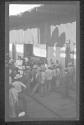 [Group of people by ware house]