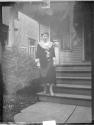 [Woman on porch steps]