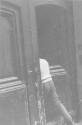 [Person Entering Doorway]