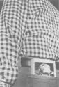 [Man with book in pocket]