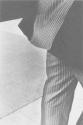 [Man in pinstripe suit]