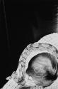 [Snake around man's neck]