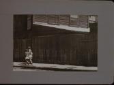 People Walking Against Building