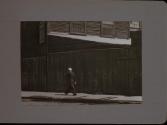 People Walking Against Building