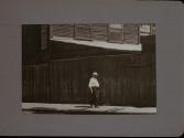 People Walking Against Building