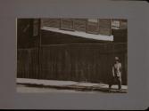 People Walking Against Building