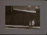 People Walking Against Building